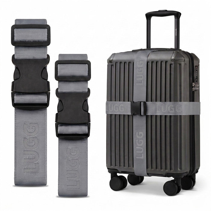 Gunmetal luggage straps in two lengths beside hardshell suitcase, buckle detail