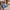 Man carrying slate blue duffle bag by twin handles through cobbled street