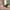 Close-up of smooth 360-degree spinner wheel on Vacay Sage Green hard shell suitcase