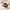 Gunmetal grey duffle bag flat lay with camera, jumper and bottle inside