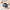 Slate blue duffle bag flat lay with camera, jumper and bottle inside