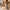 Woman rolling Army Green cabin bag through courtyard, smooth-gliding 360 spinner wheels